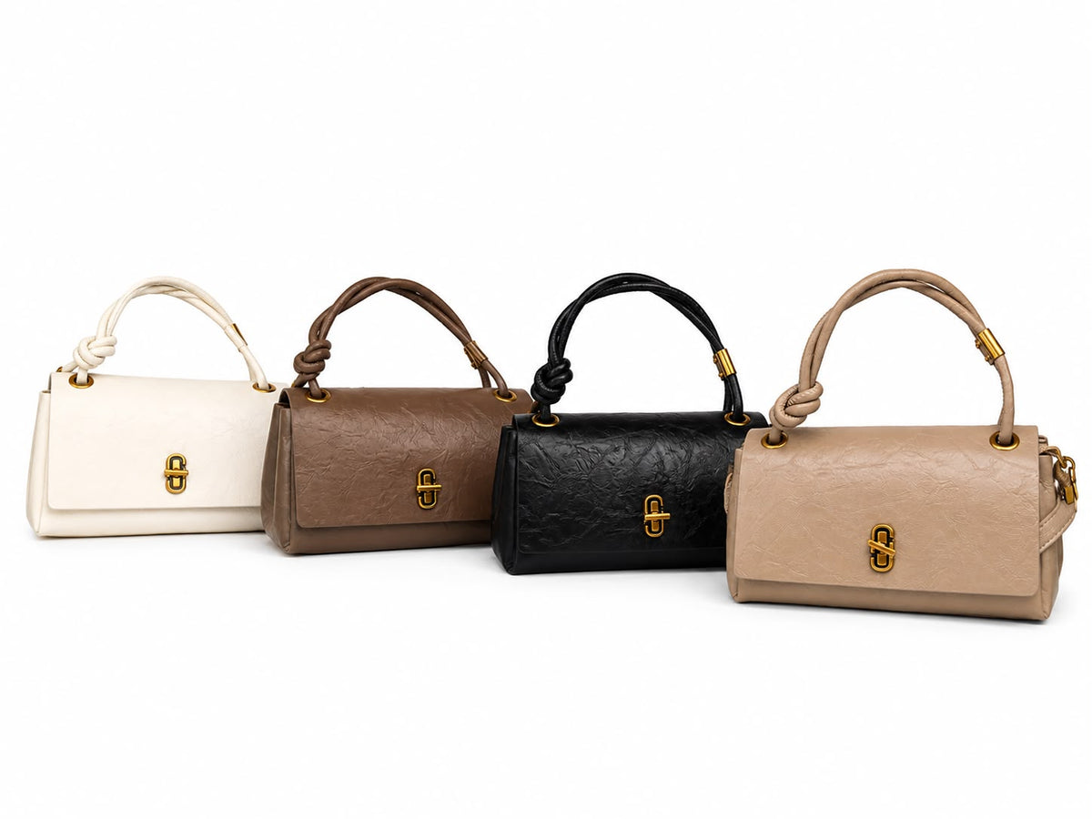 BOLSO MINI EN CUERO SINTÉTICO, CON BOLSILLOS INTERNOS, CORREA DE MANO Y UNA AJUSTABLE